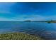 Expansive water view showcasing the tranquil bay, islands, and lush shoreline, perfect for serene waterfront living at 300 S Florida Ave # 200J, Tarpon Springs, FL 34689