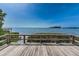 Scenic waterfront view from the deck with lush vegetation and a tranquil ambiance at 300 S Florida Ave # 200J, Tarpon Springs, FL 34689