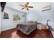 Comfortable bedroom featuring a ceiling fan, natural light, and wood-look tile flooring at 308 Jeanal Pl, Tampa, FL 33612