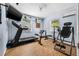 Home gym featuring wood-look tile flooring and exercise equipment at 308 Jeanal Pl, Tampa, FL 33612