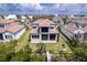 Aerial view of waterfront homes with private docks and boat lifts on a sunny day at 3122 Christophers Watch Ln, Ruskin, FL 33570