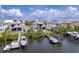 Gorgeous aerial shot of waterfront homes with docks and boat lifts, ideal for water activities and scenic views at 3122 Christophers Watch Ln, Ruskin, FL 33570