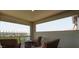 Covered balcony with seating and a view of the water at 3122 Christophers Watch Ln, Ruskin, FL 33570