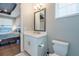 This bathroom features a single sink vanity and toilet plus a view into the main bedroom at 3122 Christophers Watch Ln, Ruskin, FL 33570