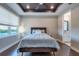 Bedroom with a dark ceiling, ceiling fan, window and hardwood floors at 3122 Christophers Watch Ln, Ruskin, FL 33570
