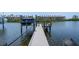 View of a boat docked along the boardwalk of this home at 3122 Christophers Watch Ln, Ruskin, FL 33570