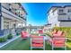 Inviting community space with outdoor seating, a fire pit, and a pool in a luxury condo complex at 3122 Christophers Watch Ln, Ruskin, FL 33570