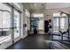 Fitness center showcasing weight training equipment and access to the outdoors at 3122 Christophers Watch Ln, Ruskin, FL 33570