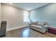 Comfortable living room with a large window, hardwood floors, sofa and accent seating at 3122 Christophers Watch Ln, Ruskin, FL 33570
