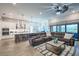 Open concept living/kitchen with stainless appliances and large sectional sofa at 3122 Christophers Watch Ln, Ruskin, FL 33570