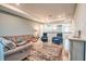 Upstairs living room with plush seating, an area rug, and tray ceilings at 3122 Christophers Watch Ln, Ruskin, FL 33570