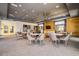 Stylish community lounge area featuring modern decor, seating, bar and tv for comfortable socializing at 3122 Christophers Watch Ln, Ruskin, FL 33570