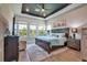 Comfortable main bedroom with large windows and ensuite bathroom at 3122 Christophers Watch Ln, Ruskin, FL 33570