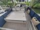Comfortable pontoon boat featuring a spacious lounge area and easy access to the water for a relaxing day out at 3122 Christophers Watch Ln, Ruskin, FL 33570