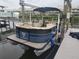 Upscale pontoon boat featuring comfortable seating, a canopy for shade, and easy docking access, perfect for leisure at 3122 Christophers Watch Ln, Ruskin, FL 33570