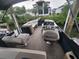 Luxury pontoon boat featuring comfortable seating and a modern helm, perfect for enjoying a day out on the water at 3122 Christophers Watch Ln, Ruskin, FL 33570