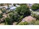 Aerial view of a home surrounded by lush trees and greenery in a residential area at 3212 56Th N Ave, St Petersburg, FL 33714