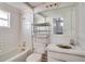 Bathroom features a bathtub, toilet, sink, and large mirror at 3212 56Th N Ave, St Petersburg, FL 33714