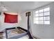 Bedroom with a broken bed frame, peeling walls, and a window letting in natural light at 3212 56Th N Ave, St Petersburg, FL 33714