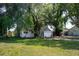 Cozy single-story home with mature trees, a lawn, and a simple walkway at 3212 56Th N Ave, St Petersburg, FL 33714
