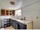 Kitchen featuring a window above the sink and cabinets, ready for renovation at 3212 56Th N Ave, St Petersburg, FL 33714