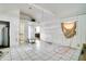 Bright, open living space features tile flooring and natural light from the window at 3212 56Th N Ave, St Petersburg, FL 33714