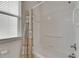 Bathroom shower and tub with white tiles and window with blinds, perfect for relaxing at 3333 Michener Pl, Plant City, FL 33566
