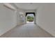 Spacious bedroom with carpet flooring, neutral walls and sliding glass doors to the patio at 3333 Michener Pl, Plant City, FL 33566