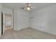Bright bedroom with neutral carpet, ceiling fan, and spacious closet for ample storage at 3333 Michener Pl, Plant City, FL 33566