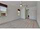 Carpeted bedroom with white walls, ceiling fan, and a view from the window at 3333 Michener Pl, Plant City, FL 33566