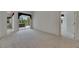 Spacious bedroom with carpet flooring, and sliding glass doors to the patio at 3333 Michener Pl, Plant City, FL 33566
