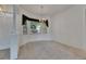Dining room with carpet, chandelier, and window letting in natural light at 3333 Michener Pl, Plant City, FL 33566
