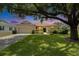 Charming single-story home with a well-manicured lawn and mature trees providing shade at 3333 Michener Pl, Plant City, FL 33566