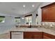 Kitchen with granite countertops, tile backsplash, and view of the living area at 3333 Michener Pl, Plant City, FL 33566