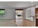Open-concept living area leading to a screened-in lanai with ample natural light throughout at 3333 Michener Pl, Plant City, FL 33566