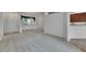 Spacious living room with gray carpeting, elegant chandelier and an open concept design at 3333 Michener Pl, Plant City, FL 33566