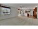 Inviting living room with access to outdoor space and views into the kitchen, perfect for entertaining at 3333 Michener Pl, Plant City, FL 33566
