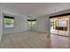 Spacious living room with access to the lanai and plenty of natural light from multiple windows at 3333 Michener Pl, Plant City, FL 33566