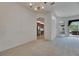 Open living room with carpet, and view of the kitchen with stainless steel appliances at 3333 Michener Pl, Plant City, FL 33566