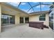 Covered lanai features a hot tub and multiple sliding glass doors to enter the property at 3333 Michener Pl, Plant City, FL 33566