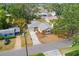 Aerial view of the property and neighborhood with mature trees at 3417 1St W Ave, Bradenton, FL 34205