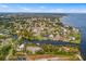 This aerial view features a neighborhood on the water with luscious green trees at 3417 1St W Ave, Bradenton, FL 34205
