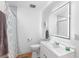 This bathroom features a shower, a towel rack with a towel, a vanity, and a mirror at 3417 1St W Ave, Bradenton, FL 34205