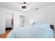 Bedroom featuring an attached closet and bathroom with a ceiling fan and hardwood floors at 3417 1St W Ave, Bradenton, FL 34205