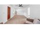 Bedroom with neutral paint, carpet, ceiling fan, furniture, hardwood floors, and 2 doors at 3417 1St W Ave, Bradenton, FL 34205