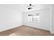 Bedroom with neutral paint, carpet, ceiling fan, large window and lots of natural light at 3417 1St W Ave, Bradenton, FL 34205