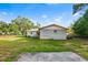 Exterior view of the house showing a nice grassy area and a partial view of the house at 3417 1St W Ave, Bradenton, FL 34205