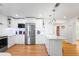 Bright kitchen features stainless steel appliances, white cabinets and light countertops with lots of storage at 3417 1St W Ave, Bradenton, FL 34205