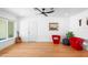 Living room with modern furniture, hardwood floors, large window and view of pool at 3417 1St W Ave, Bradenton, FL 34205