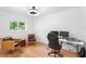 This office is designed with hardwood floors, natural light, and two leather chairs at 3417 1St W Ave, Bradenton, FL 34205